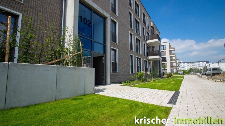 Hausansicht D�sseldorf Erdgeschosswohnung Wohnen im neuen Quartier VIERZIG549 - moderne Wohnung mit Parkett, glatten W�nden, Einbauk�che....